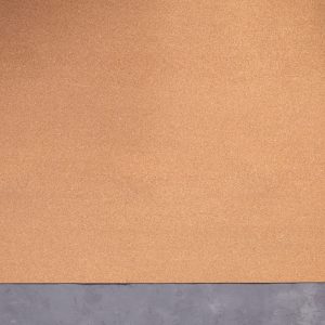 Roll of cork at cement floor background texture. Corkboard at wall